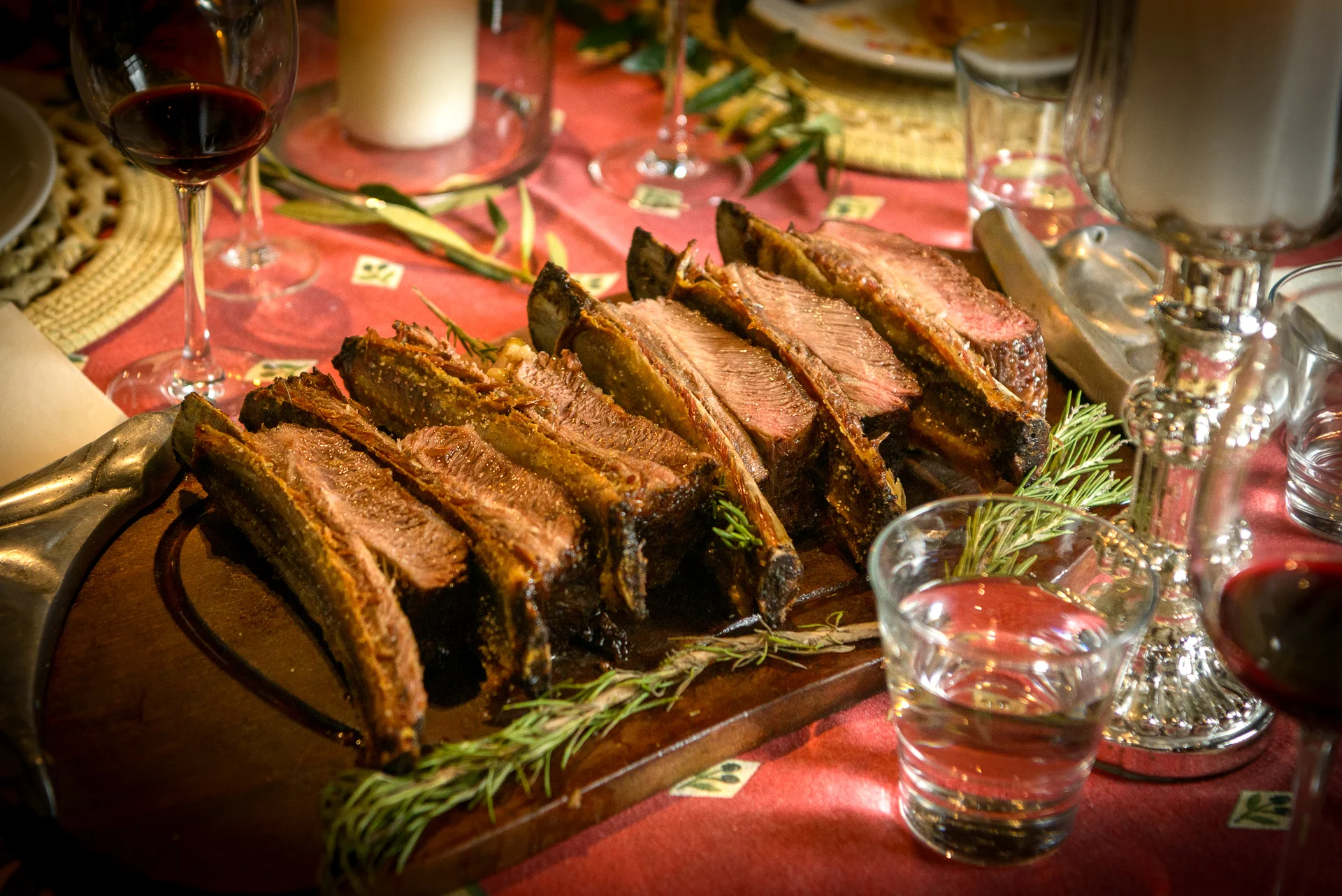 Sliced ribs with rosemary on the board