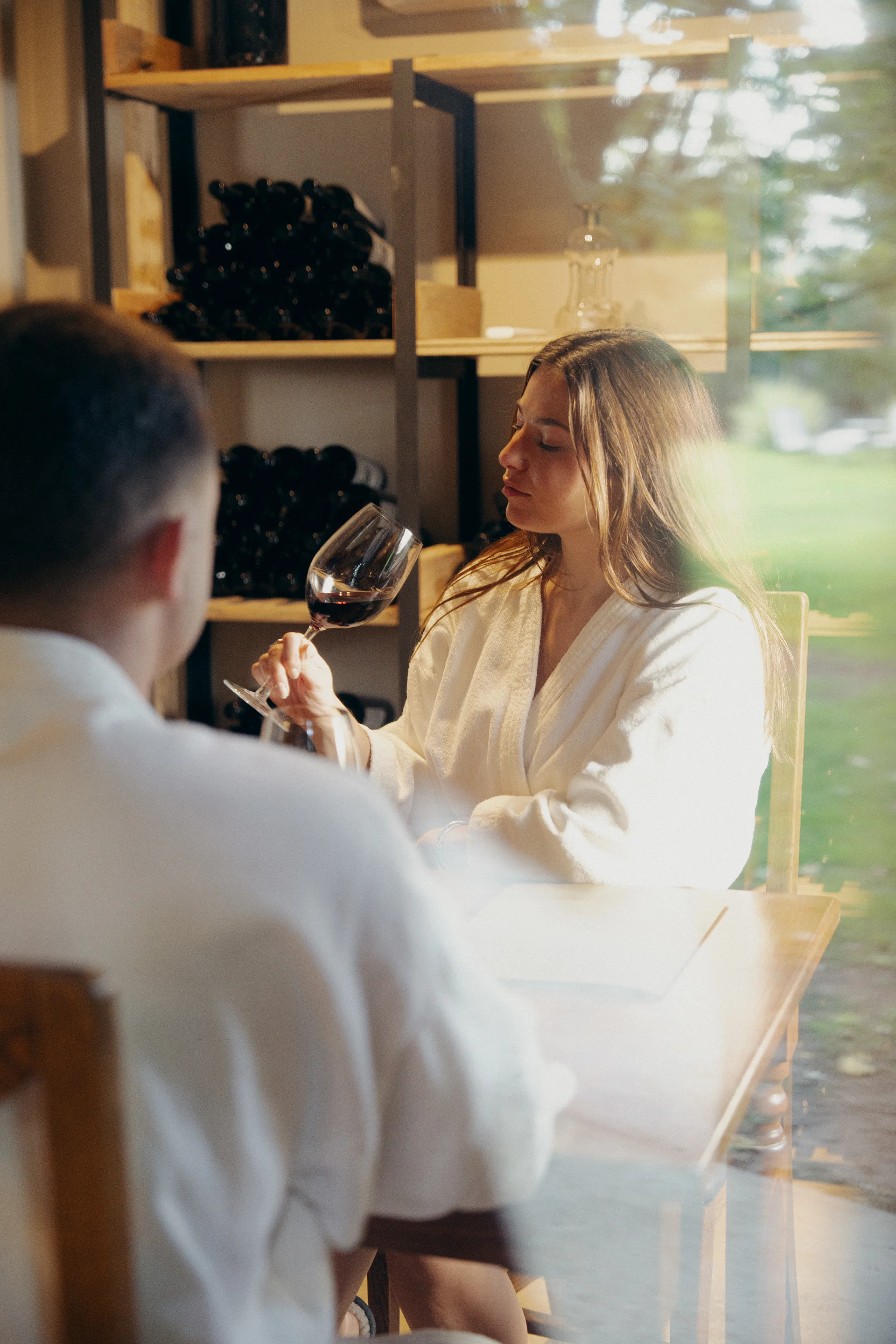 Tasting a glass of Malbec inside the Cava