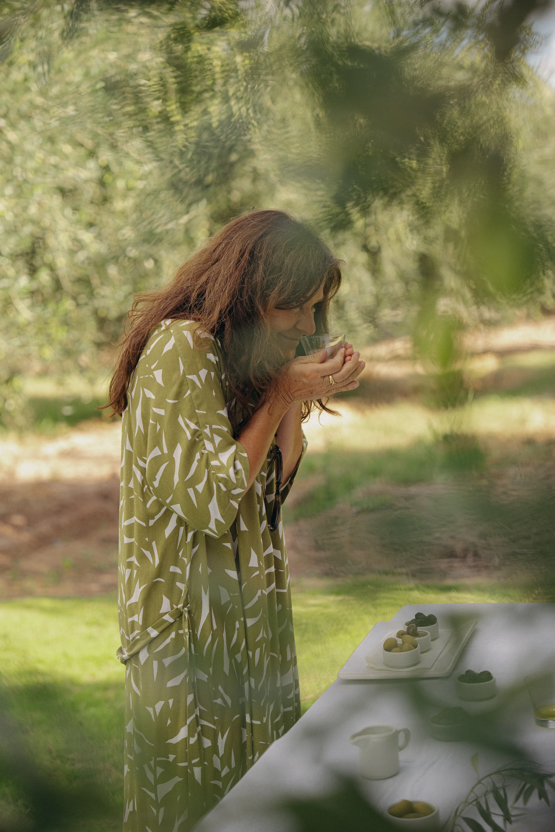 Smelling olive oil in the grove