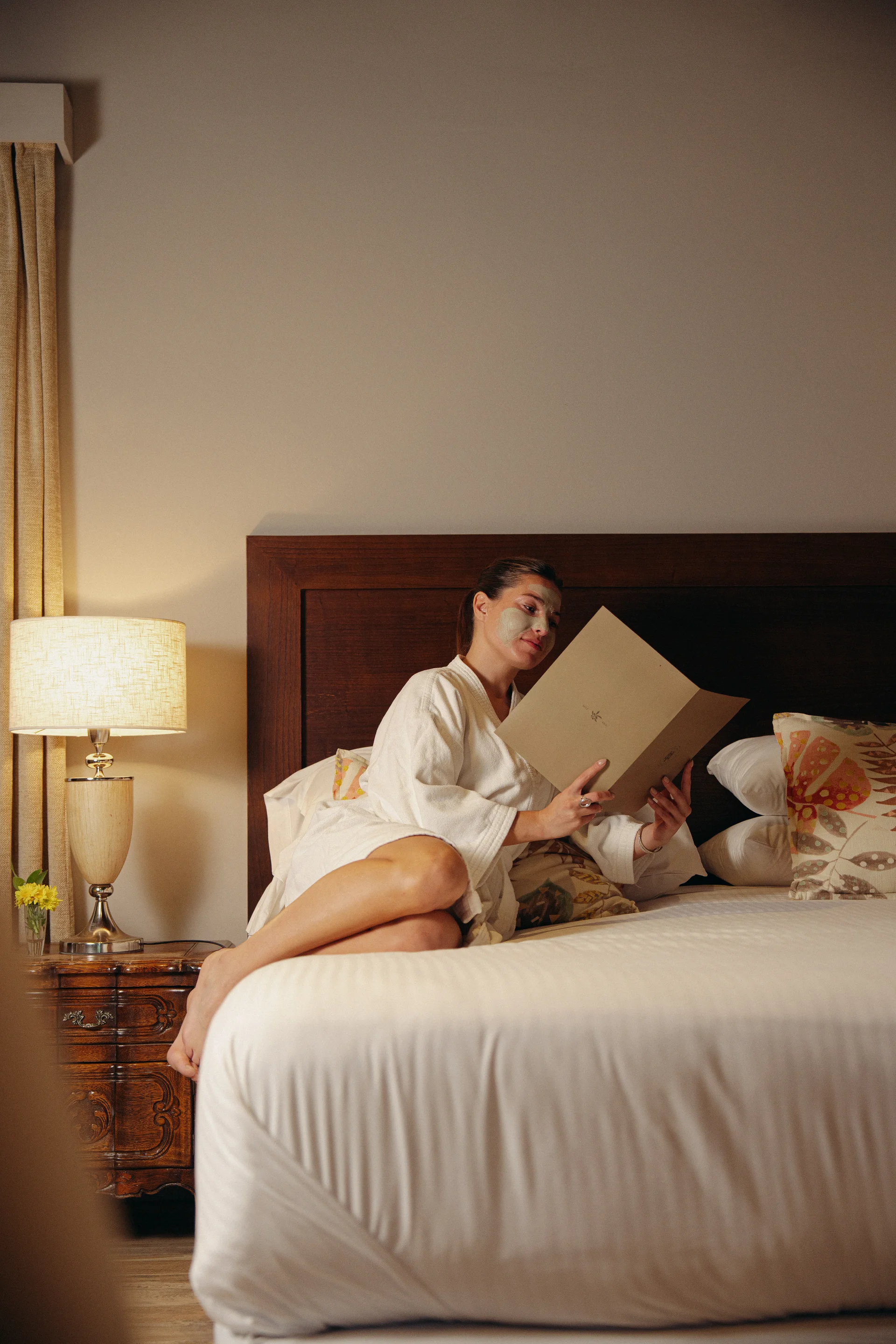 Reading on the bed in the Loft Suite