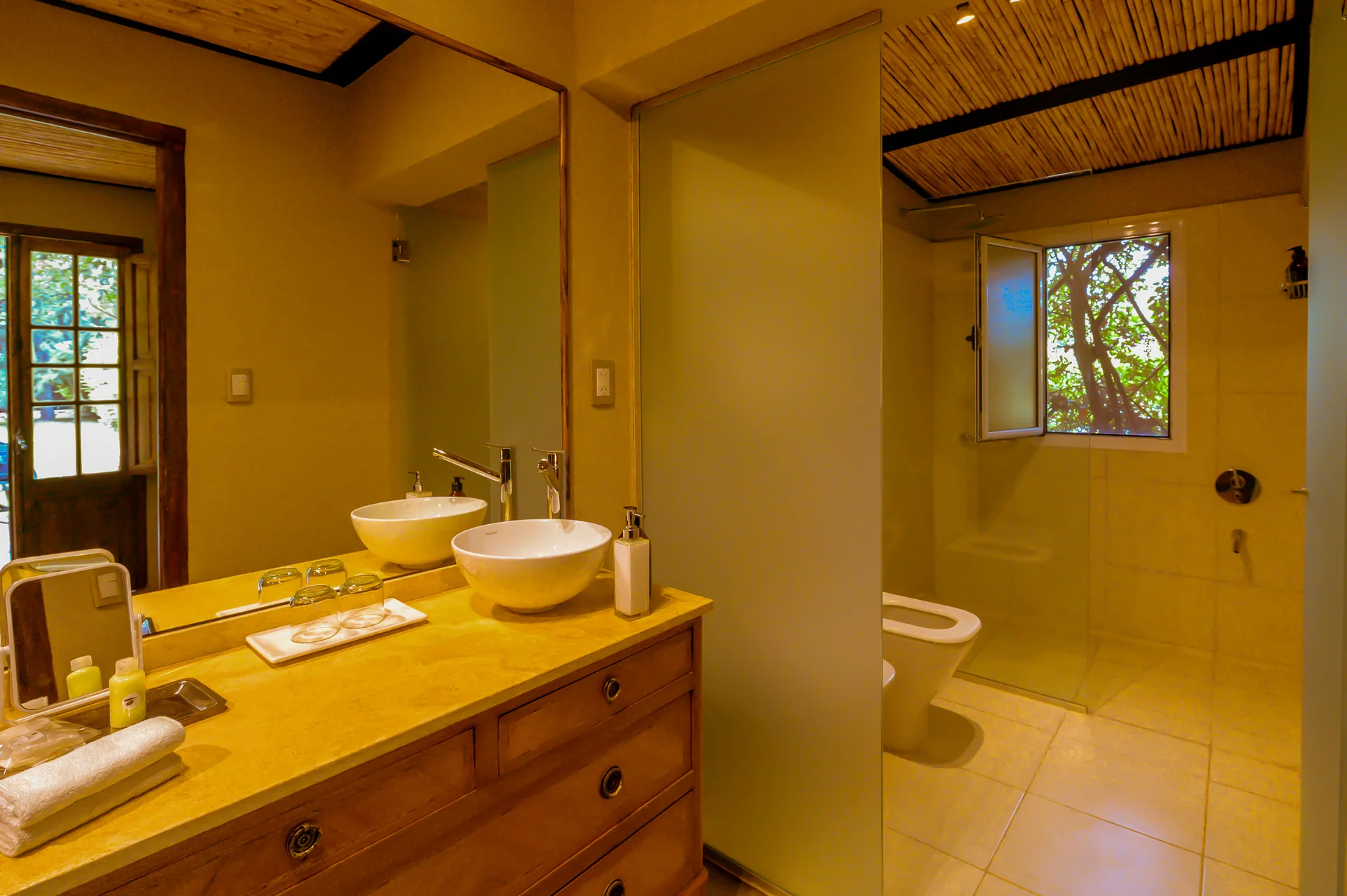 The Cava Experience bathroom, with a double basin and a walk-in shower